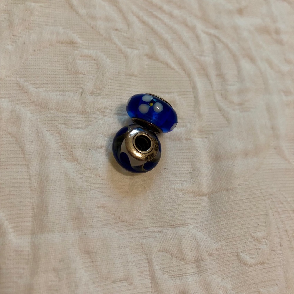 Blue and white glass pandora charms (both)